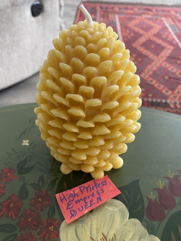 Beeswax pinecone candle.